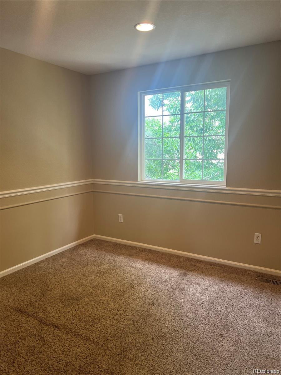 5353 Rhyolite Way Parker, CO 80134 - Photo 11 of 22 an empty room with a window