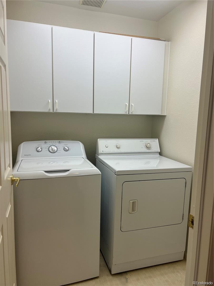 5353 Rhyolite Way Parker, CO 80134 - Photo 15 of 22 a utility room with dryer and washer