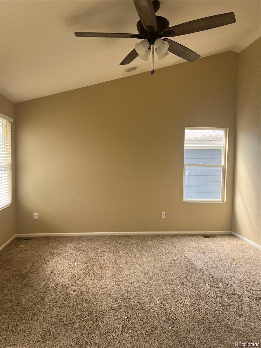 5353 Rhyolite Way Parker, CO 80134 - Photo 20 of 22 an empty room with a window and a fan