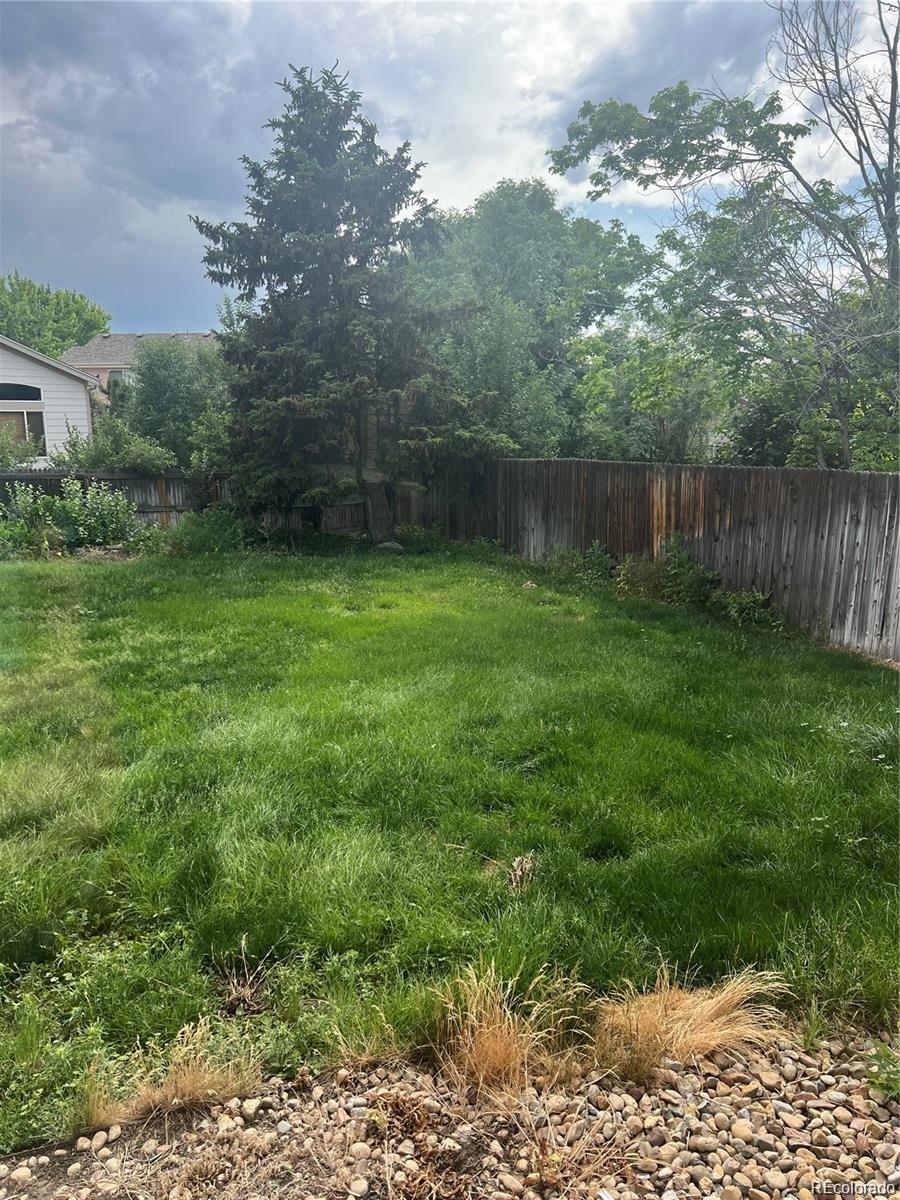 5353 Rhyolite Way Parker, CO 80134 - Photo 21 of 22 a view of a backyard of the house