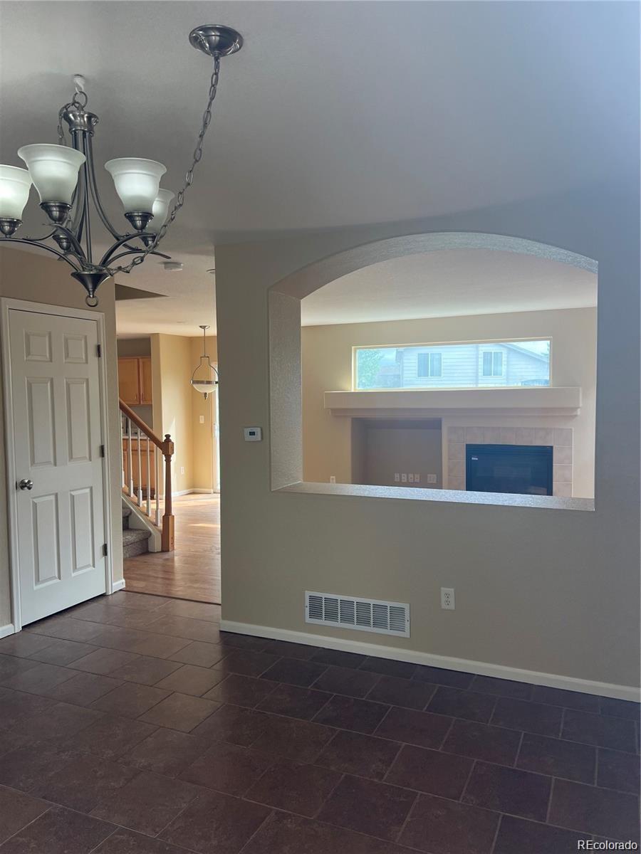 5353 Rhyolite Way Parker, CO 80134 - Photo 4 of 22 a view of an empty room with a window