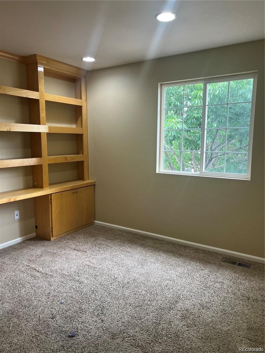 5353 Rhyolite Way Parker, CO 80134 - Photo 10 of 22 a view of an empty room with a window