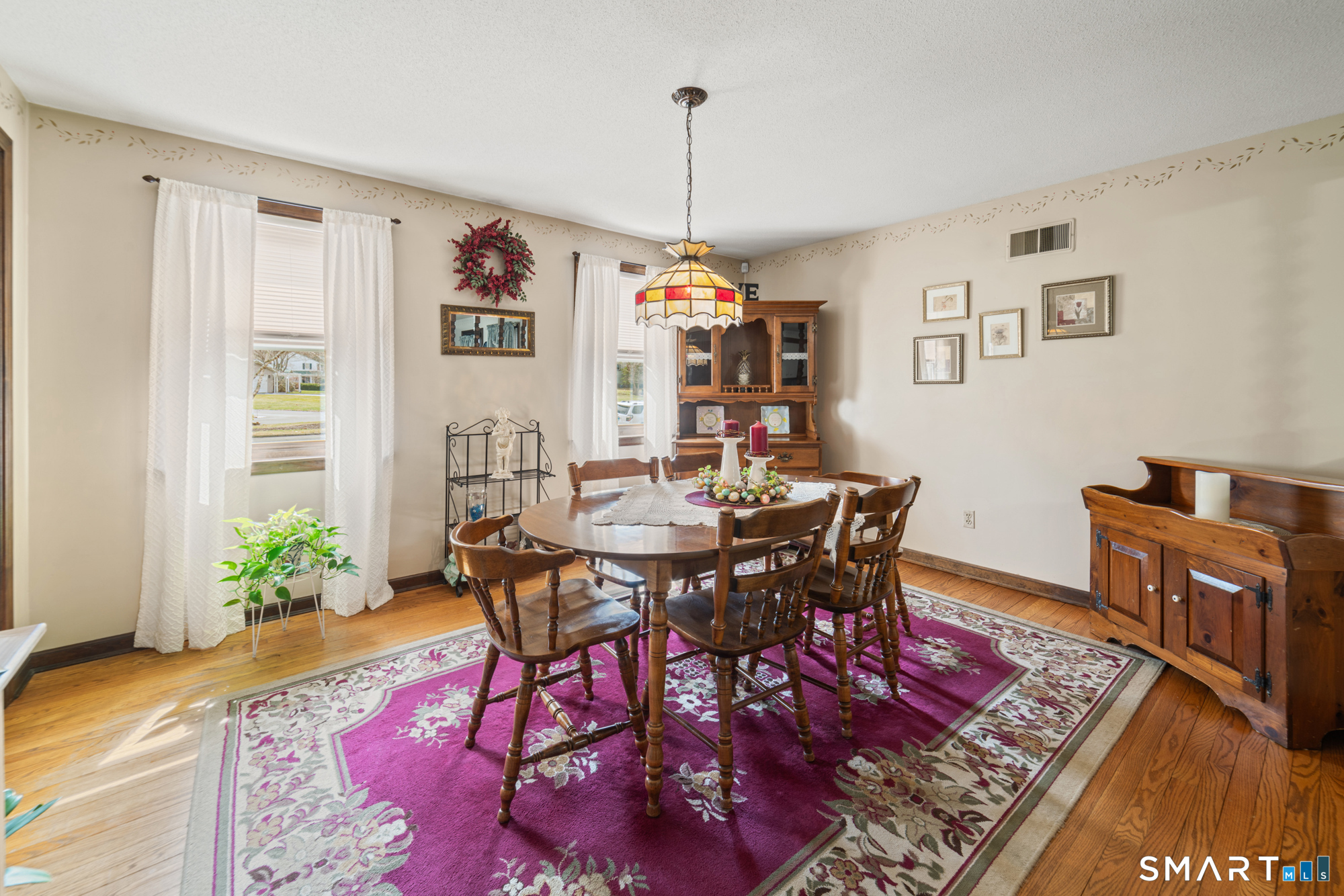 46 Buckboard Lane Bristol, CT 06010 - Photo 12 of 39 a view of a dining room with furniture window and wooden floor