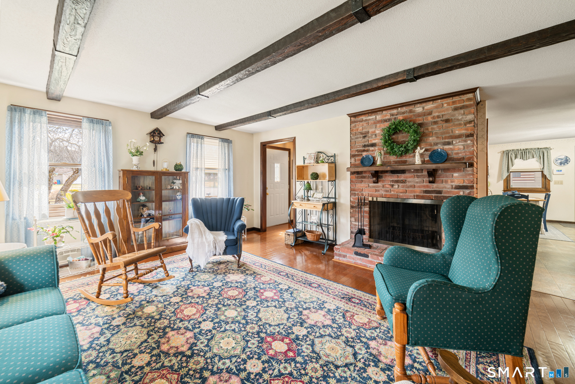 46 Buckboard Lane Bristol, CT 06010 - Photo 15 of 39 a living room with fireplace furniture and a large window