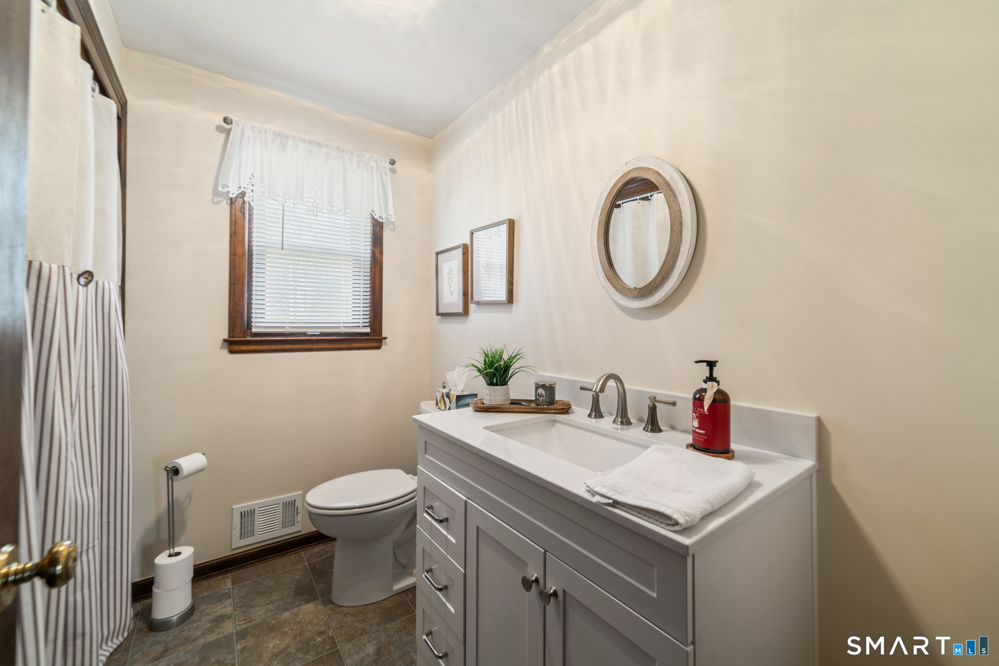 46 Buckboard Lane Bristol, CT 06010 - Photo 20 of 39 a bathroom with a sink and a mirror