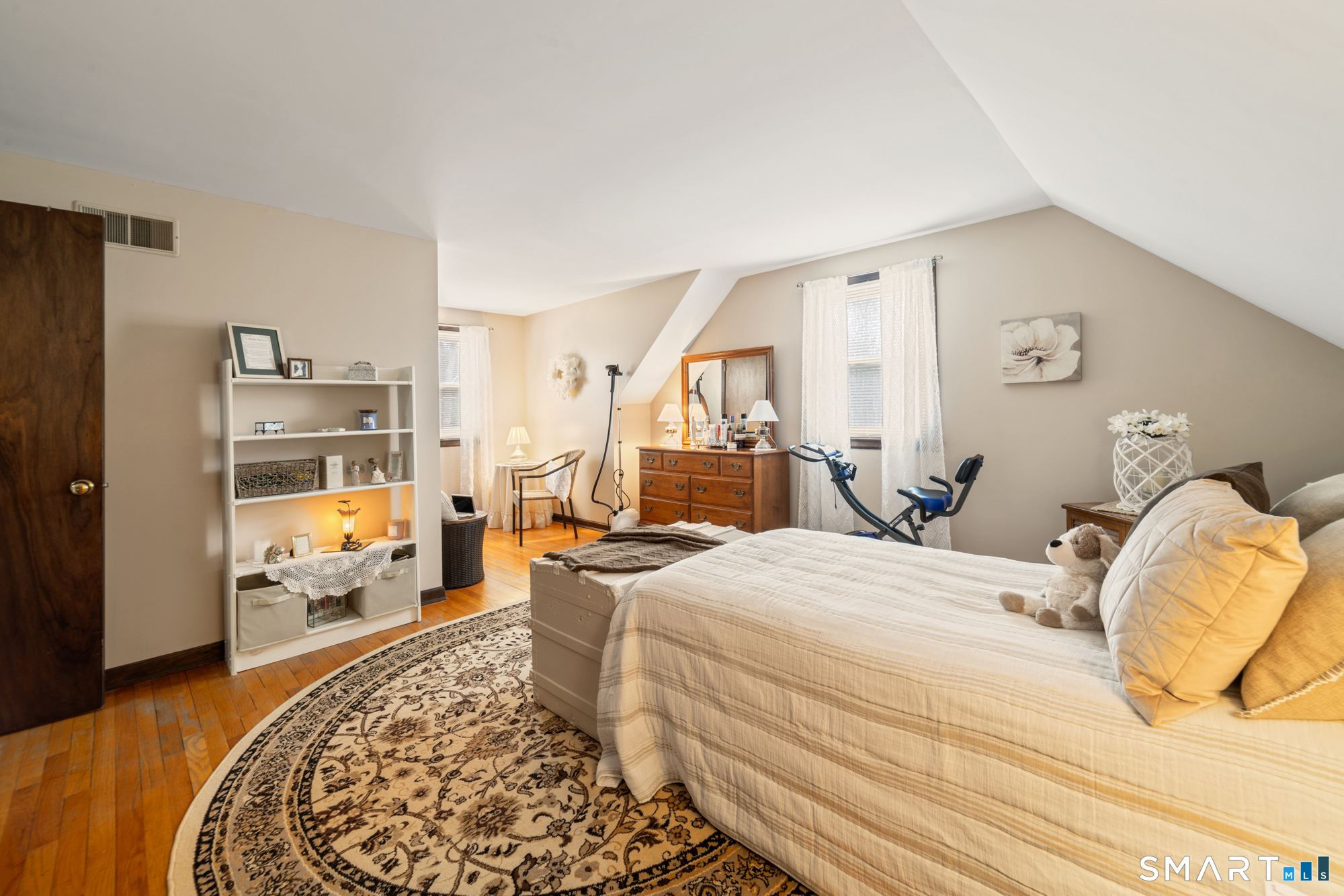 46 Buckboard Lane Bristol, CT 06010 - Photo 24 of 39 a bedroom with a bed and wooden floor