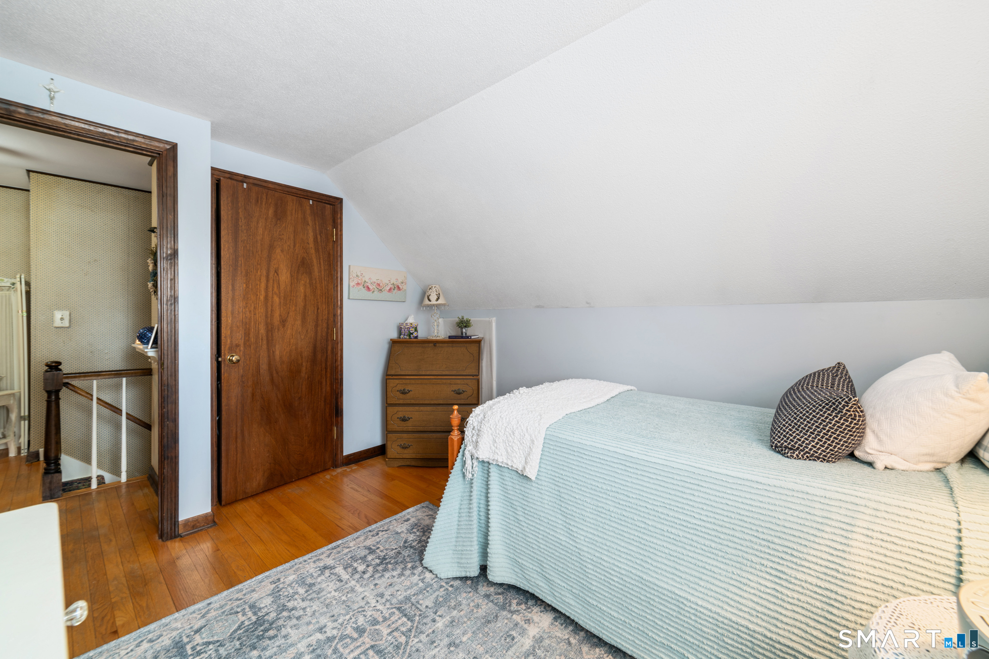46 Buckboard Lane Bristol, CT 06010 - Photo 27 of 39 a bedroom with a bed and wooden floor
