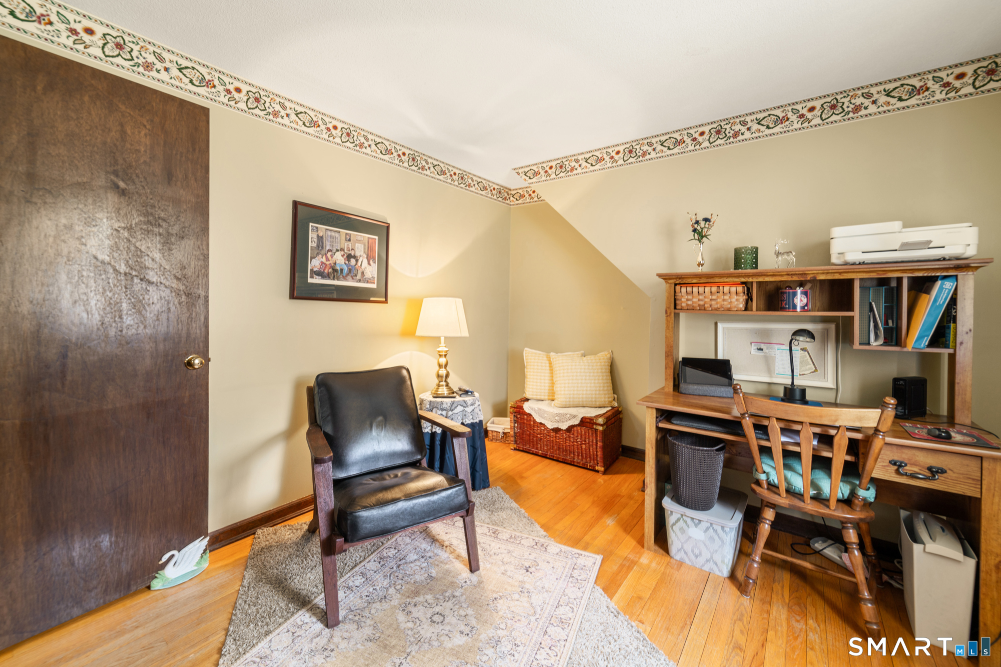 46 Buckboard Lane Bristol, CT 06010 - Photo 29 of 39 a living room with furniture a piano and a bookshelf