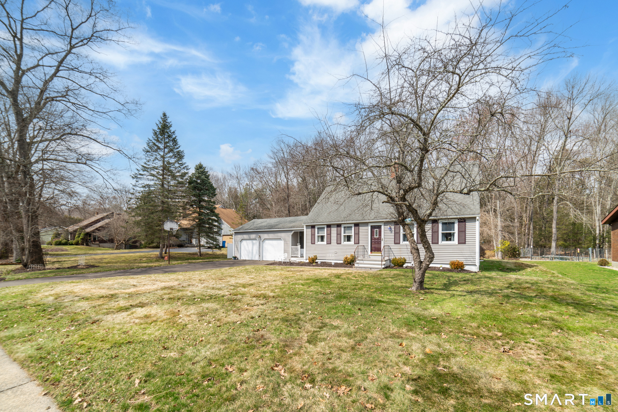 46 Buckboard Lane Bristol, CT 06010 - Photo 3 of 39 a view of a house with a big yard and large trees