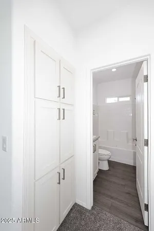 a bathroom with a toilet sink and a shower