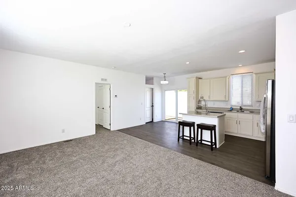 a view of kitchen with stainless steel appliances cabinets