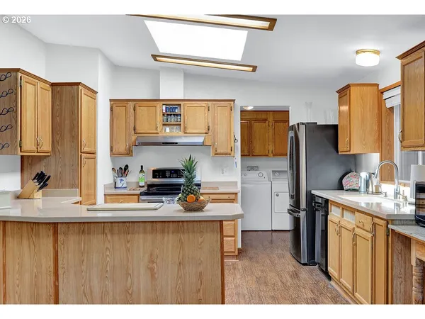 a kitchen with a refrigerator and a sink