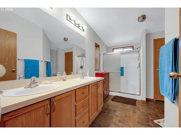 a view of bathroom with a shower and a sink