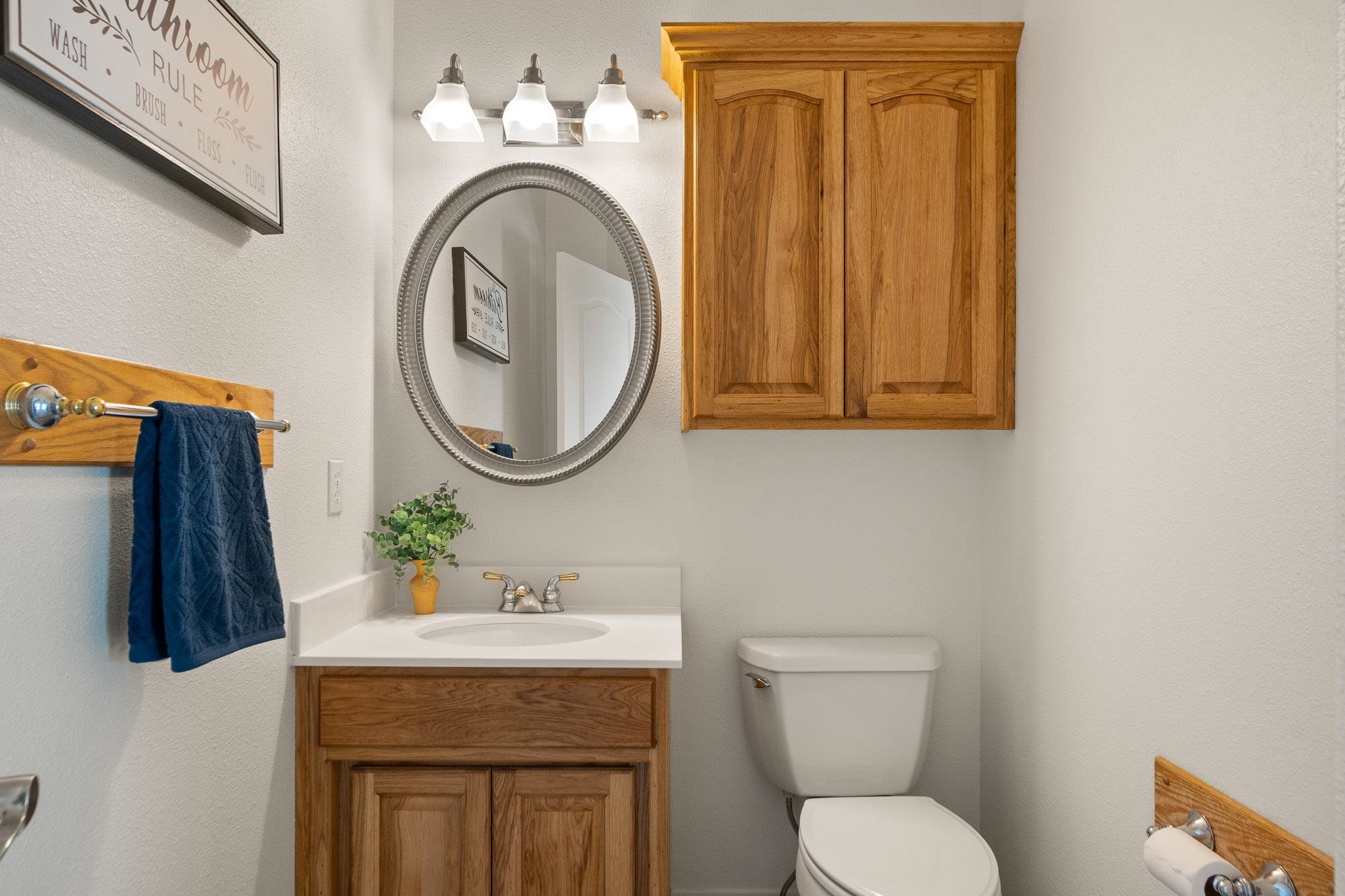 2107 I I- 1/2 Road Grand Junction, CO 81505 - Photo 16 of 42 a bathroom with a toilet a sink and a mirror