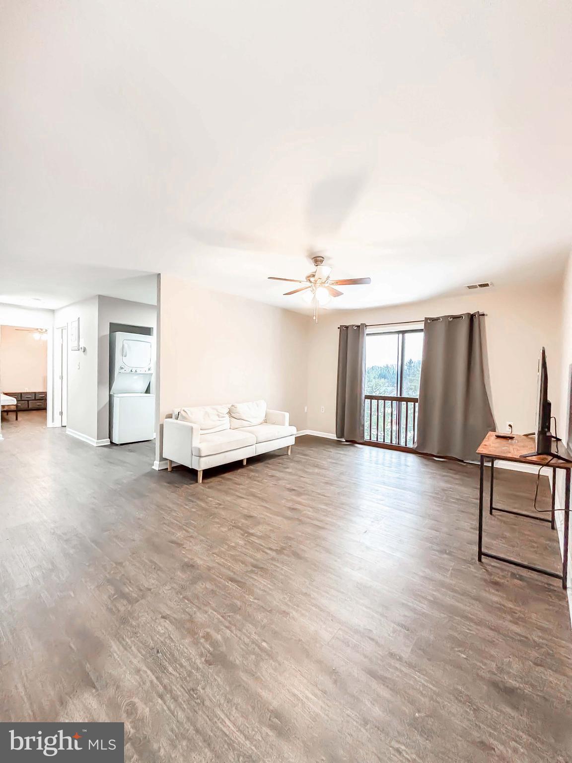 3924 Rolling Rd., Unit B11 Pikesville, MD 21208 - Photo 12 of 31 a view of livingroom with furniture and wooden floor