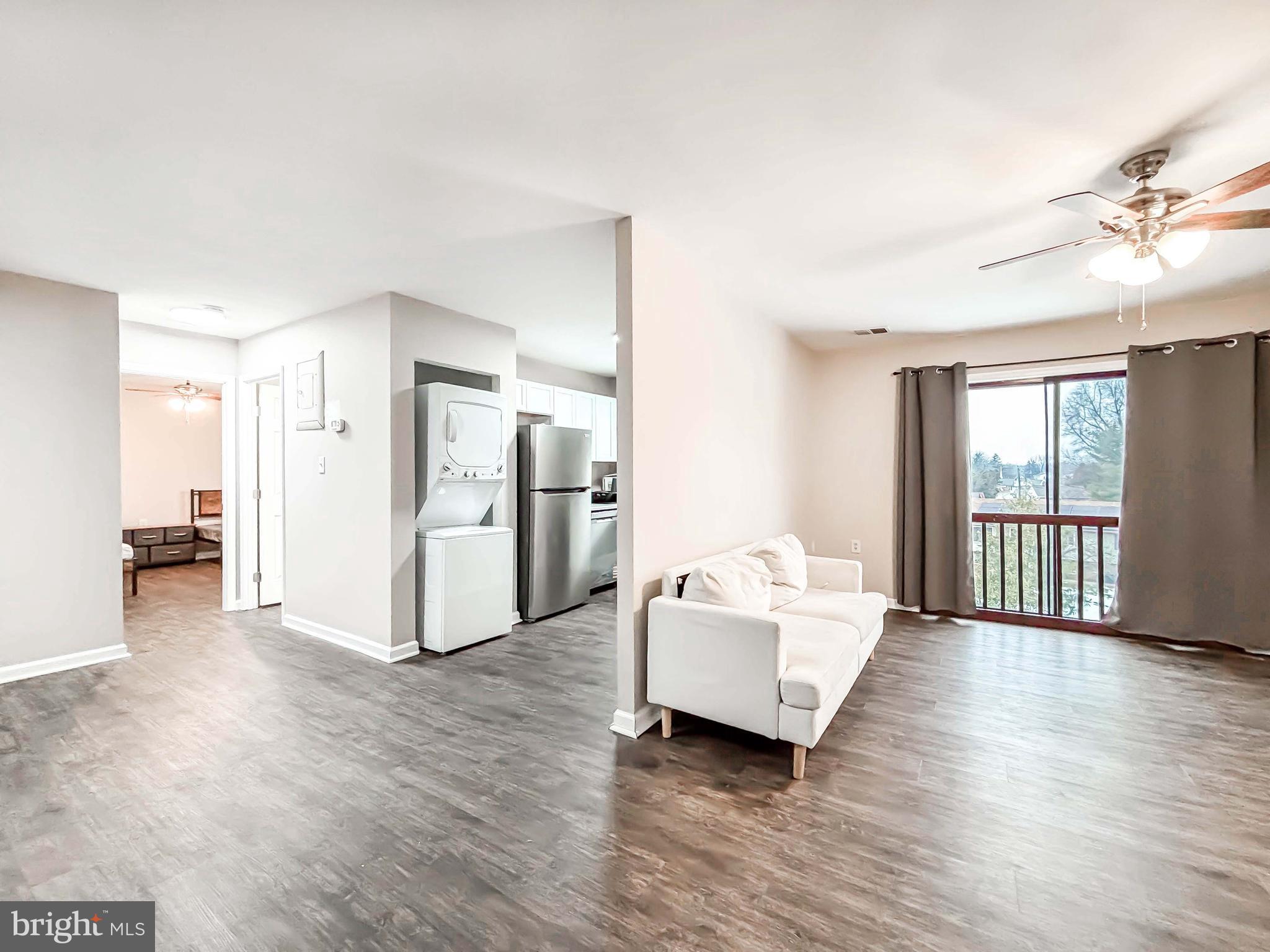 3924 Rolling Rd., Unit B11 Pikesville, MD 21208 - Photo 15 of 31 a living room with furniture and a window