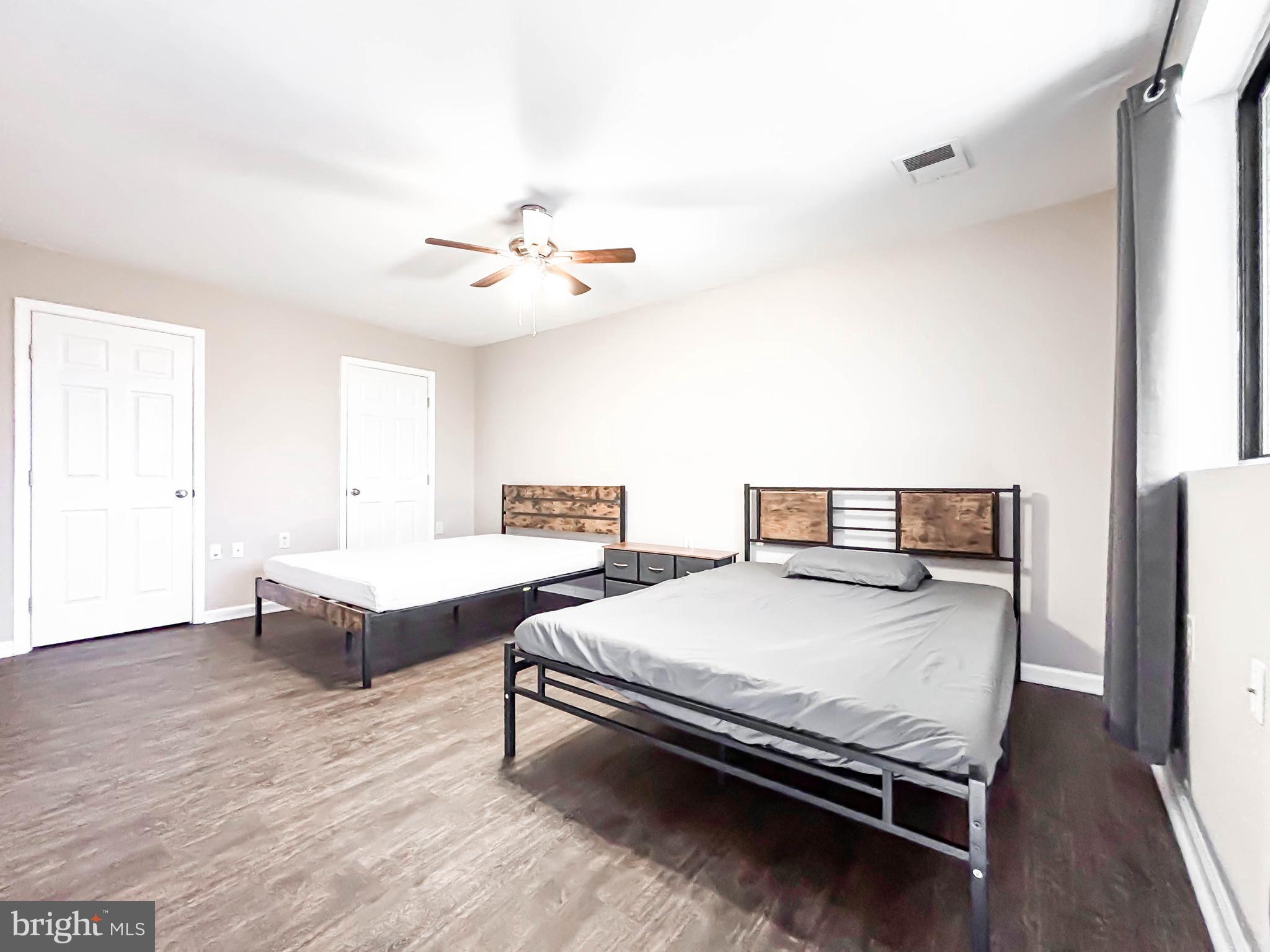 3924 Rolling Rd., Unit B11 Pikesville, MD 21208 - Photo 24 of 31 a bedroom with a bed and a chandelier