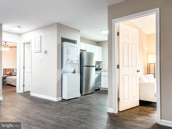 a view of a kitchen with a stove cabinets and wooden floor