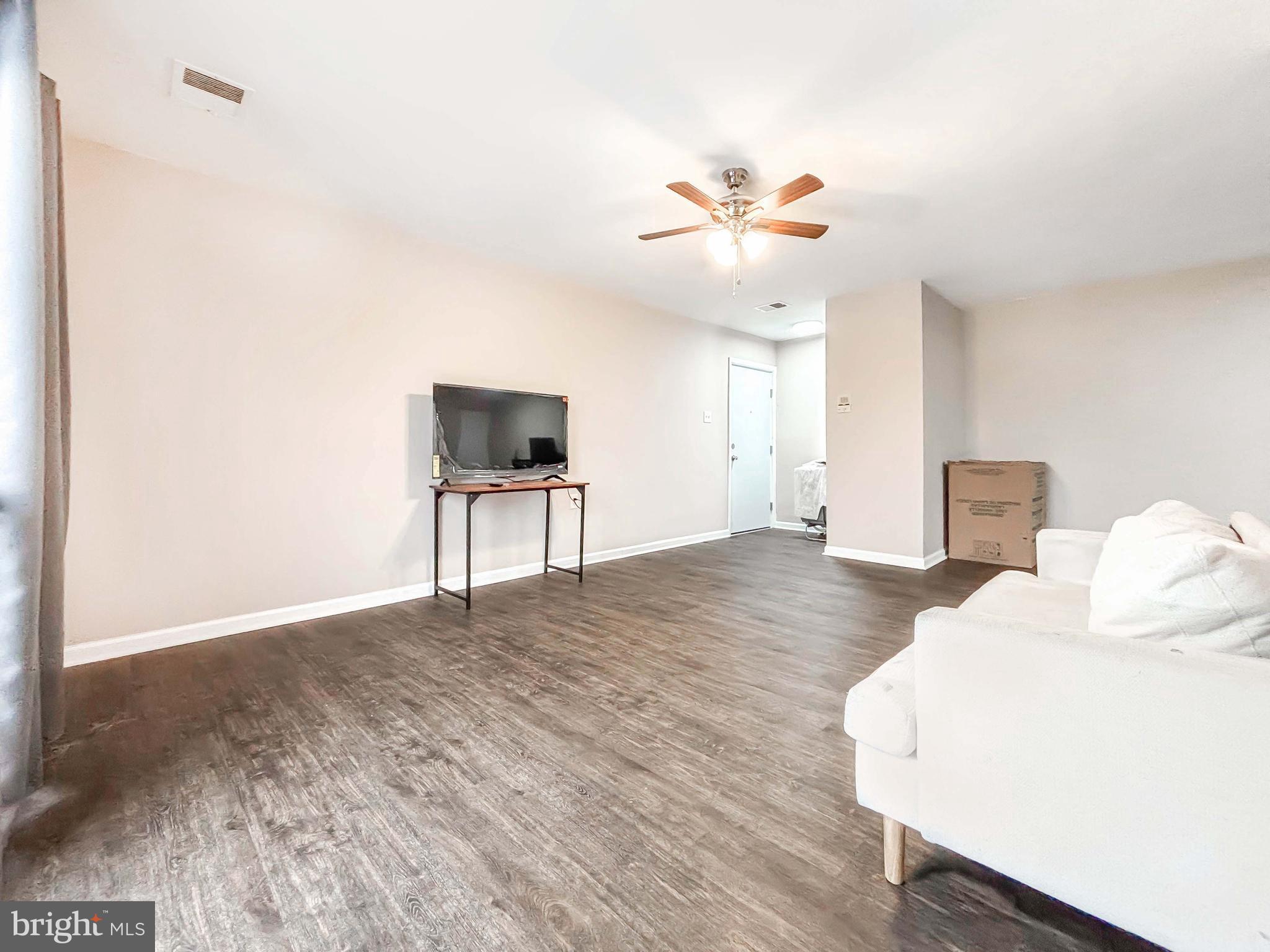 3924 Rolling Rd., Unit B11 Pikesville, MD 21208 - Photo 7 of 31 a view of a livingroom with wooden floor