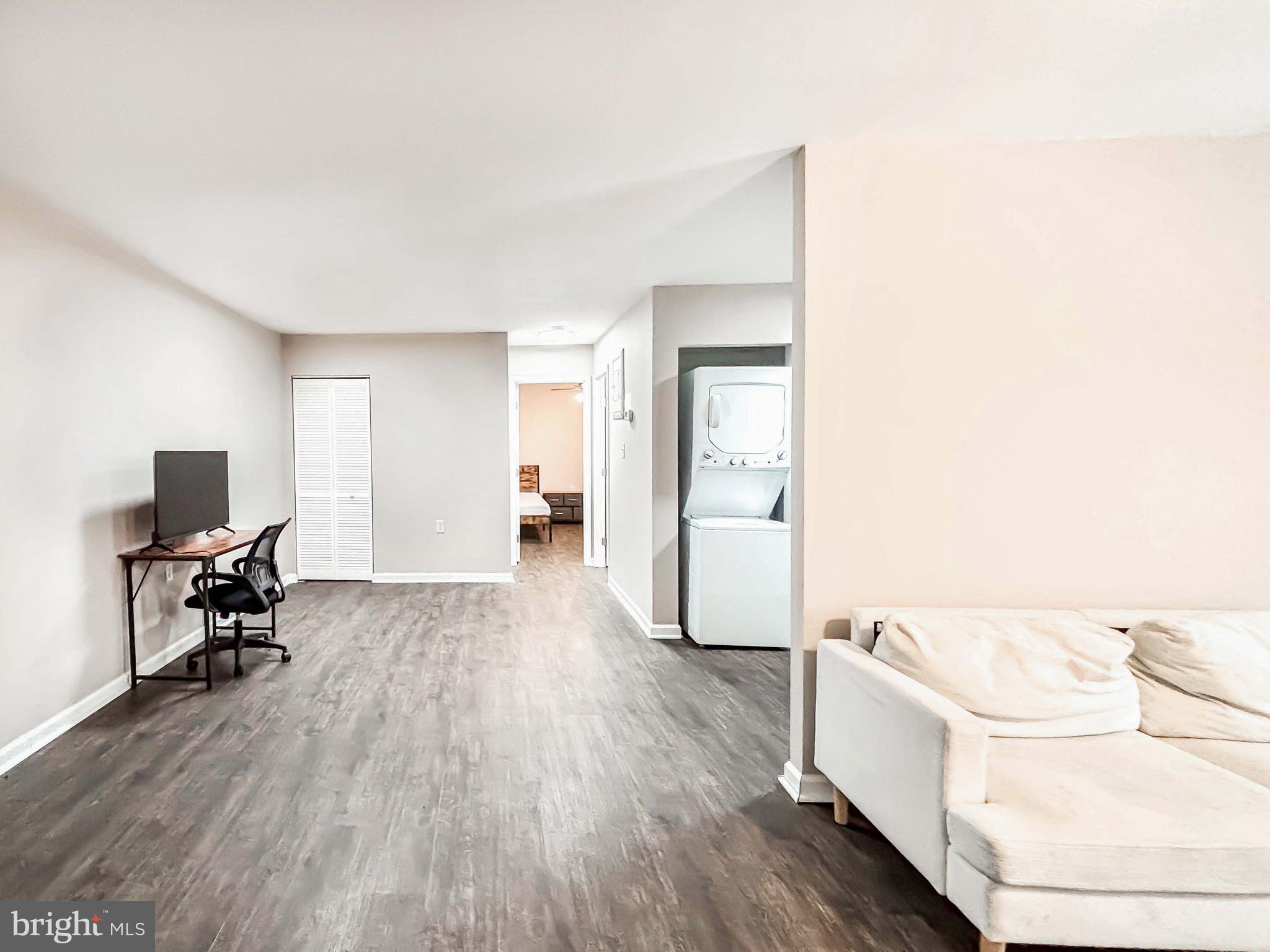 3924 Rolling Rd., Unit B11 Pikesville, MD 21208 - Photo 8 of 31 a living room with furniture and a flat screen tv