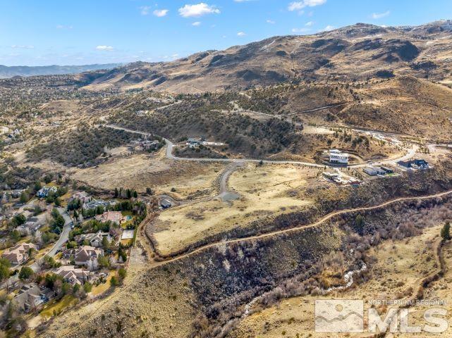 4595 Woodchuck Circle Reno, NV 89519 - Photo 4 of 7 a view of a yard with a mountain