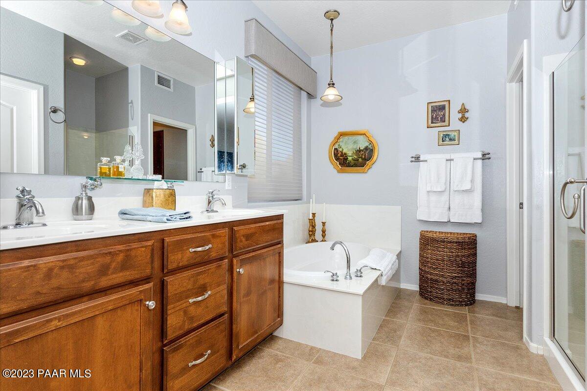 1908 North Fire Butte Way Prescott Valley, AZ 86314 - Photo 18 of 52 a bathroom with a sink a vanity and mirror