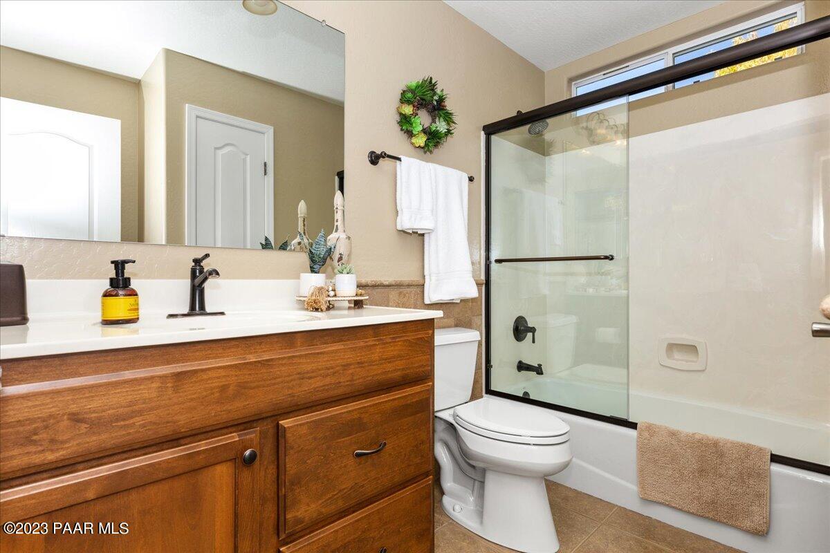 1908 North Fire Butte Way Prescott Valley, AZ 86314 - Photo 19 of 52 a bathroom with a sink a toilet and shower