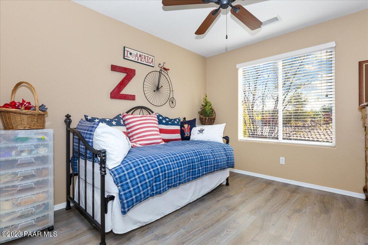 1908 North Fire Butte Way Prescott Valley, AZ 86314 - Photo 24 of 52 a bedroom with a bed and next to a window