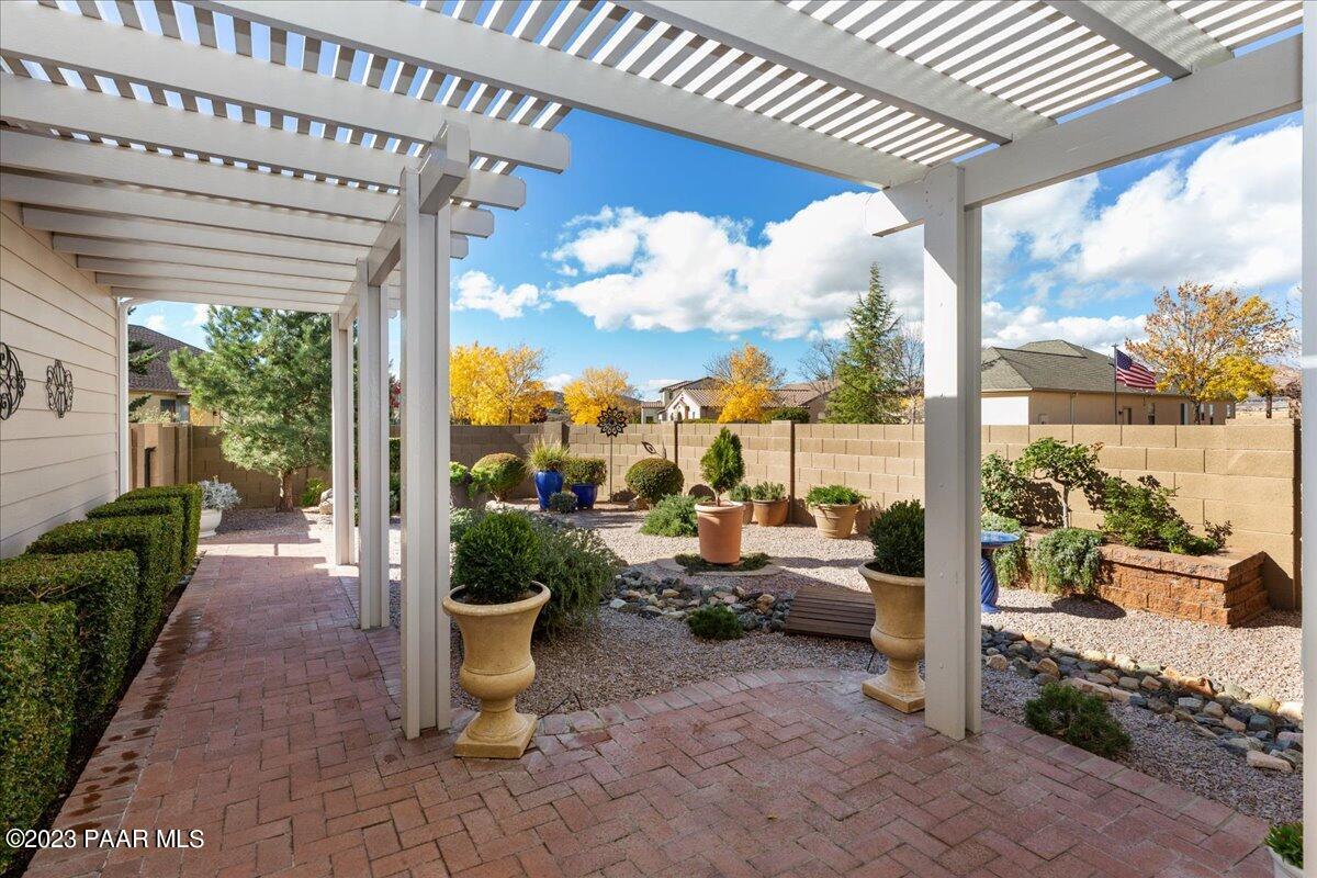 1908 North Fire Butte Way Prescott Valley, AZ 86314 - Photo 27 of 52 a building outdoor space with patio furniture and potted plants