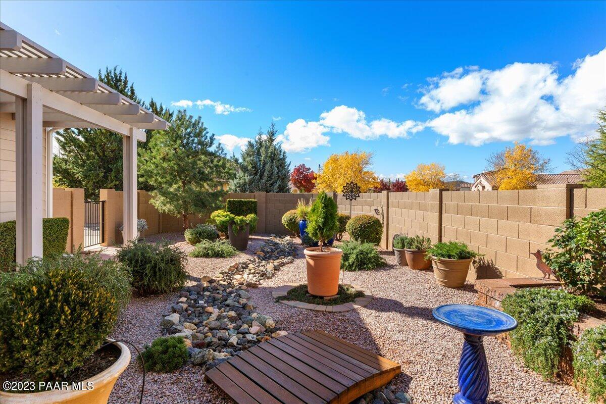 1908 North Fire Butte Way Prescott Valley, AZ 86314 - Photo 28 of 52 a view of a backyard with sitting area and outdoor seating