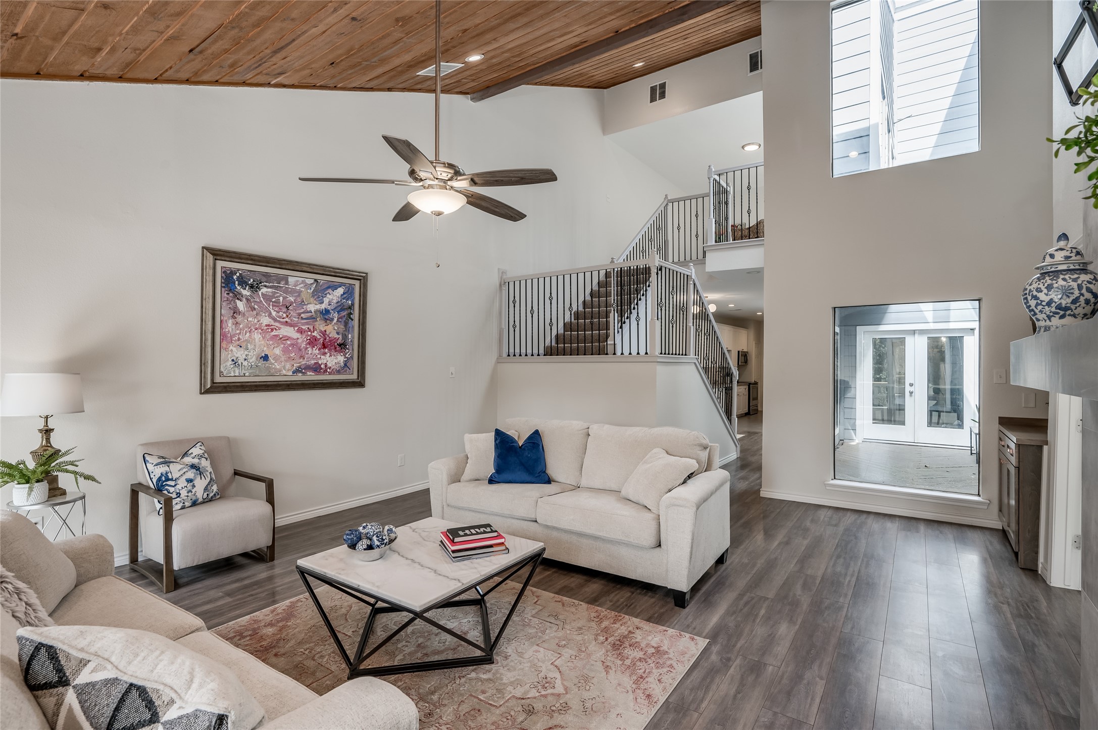 387 Rancho Bauer Drive Houston, TX 77079 - Photo 13 of 32 a living room with furniture a ceiling fan and a window