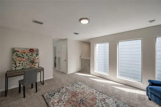 a view of livingroom with furniture and window