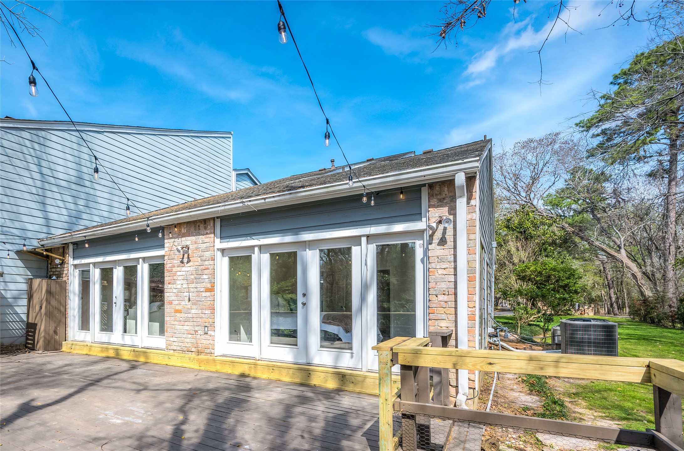 387 Rancho Bauer Drive Houston, TX 77079 - Photo 30 of 32 a front view of a house with garden