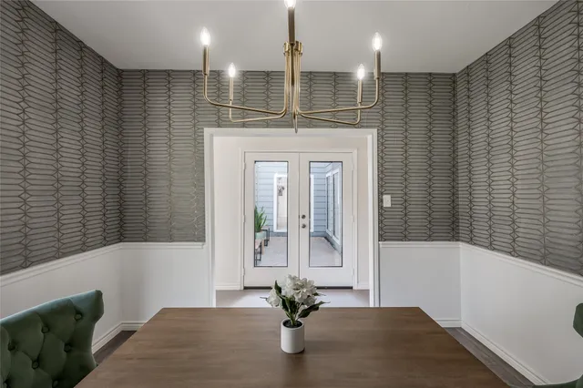 a bathroom with a sink a faucet a potted plant and a shower