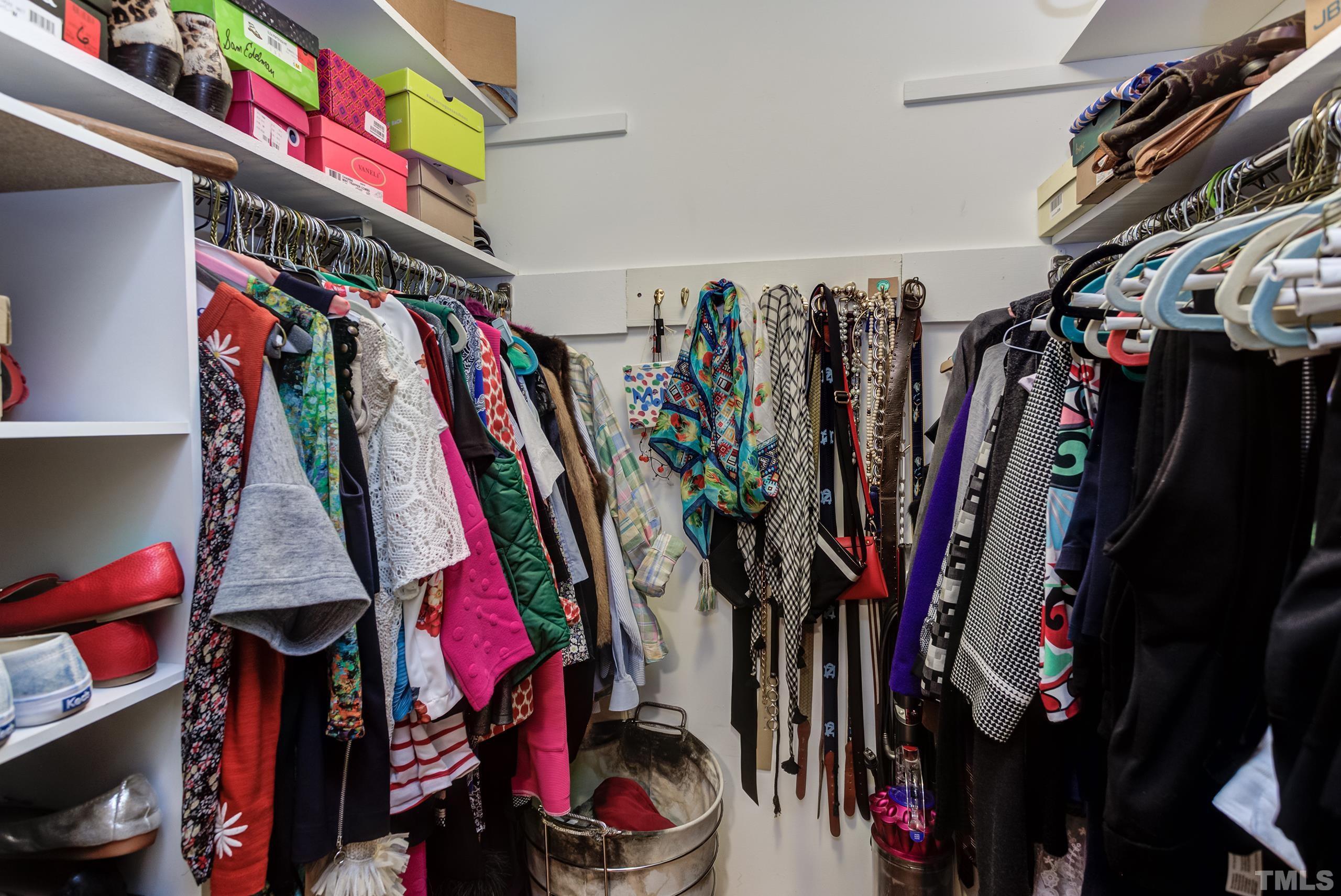 2509 Catalina Court Raleigh, NC 27607 - Photo 14 of 29 a view of walk in closet with clothes
