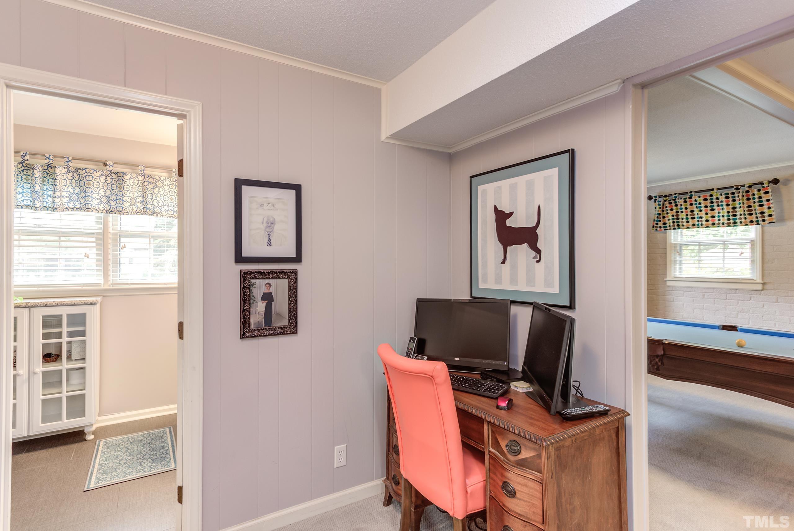 2509 Catalina Court Raleigh, NC 27607 - Photo 22 of 29 a view of a workspace with furniture and a window