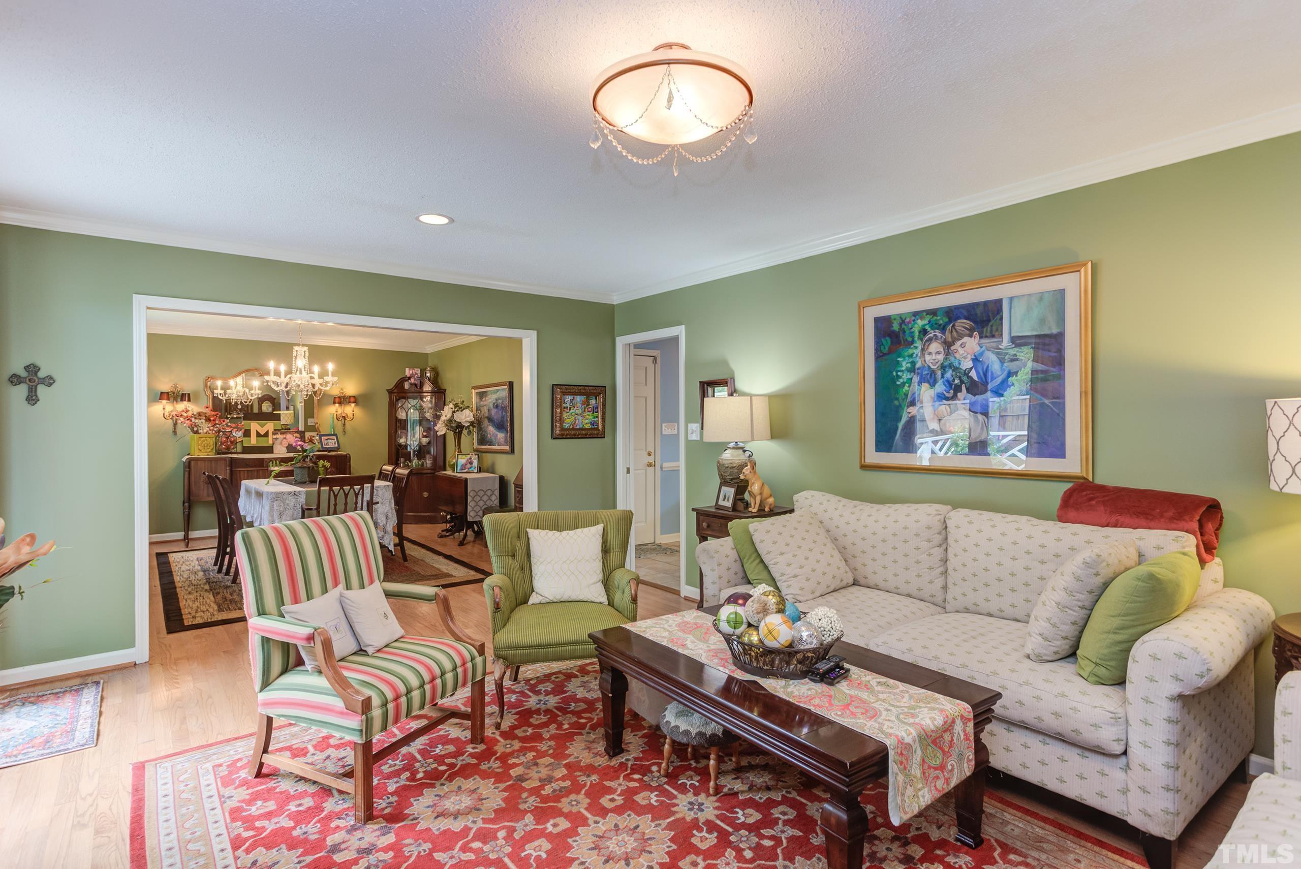 2509 Catalina Court Raleigh, NC 27607 - Photo 5 of 29 a living room with furniture and a large window