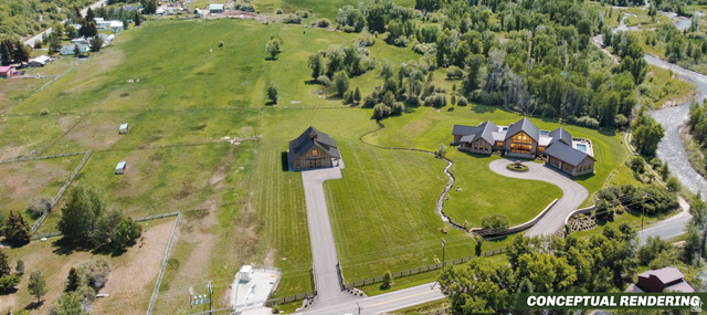 4347 South Bench Creek Road Kamas, UT 84036 - Photo 1 of 23 Expansive property featuring two distinct structures, a winding paved driveway, and manicured lawns