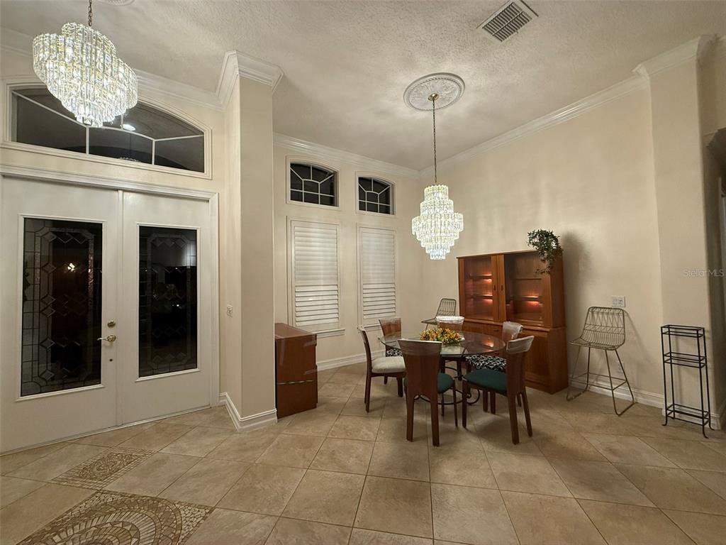 1849 Watermere Lane Windermere, FL 34786 - Photo 4 of 31 a view of a dining room with furniture and chandelier