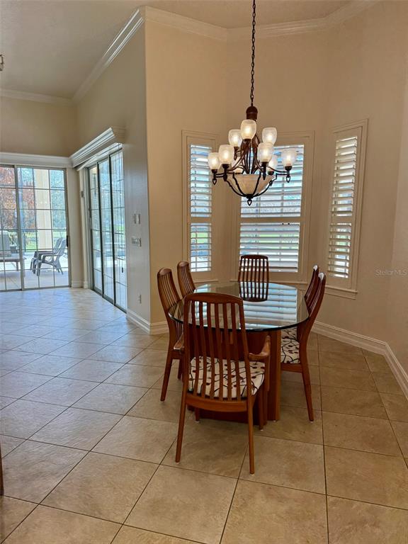 1849 Watermere Lane Windermere, FL 34786 - Photo 9 of 31 a dining room with furniture and window
