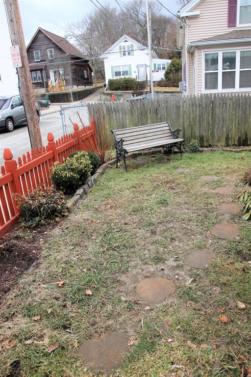 95 Union Street Woonsocket, RI 02895 - Photo 2 of 3 a front view of a house with a yard