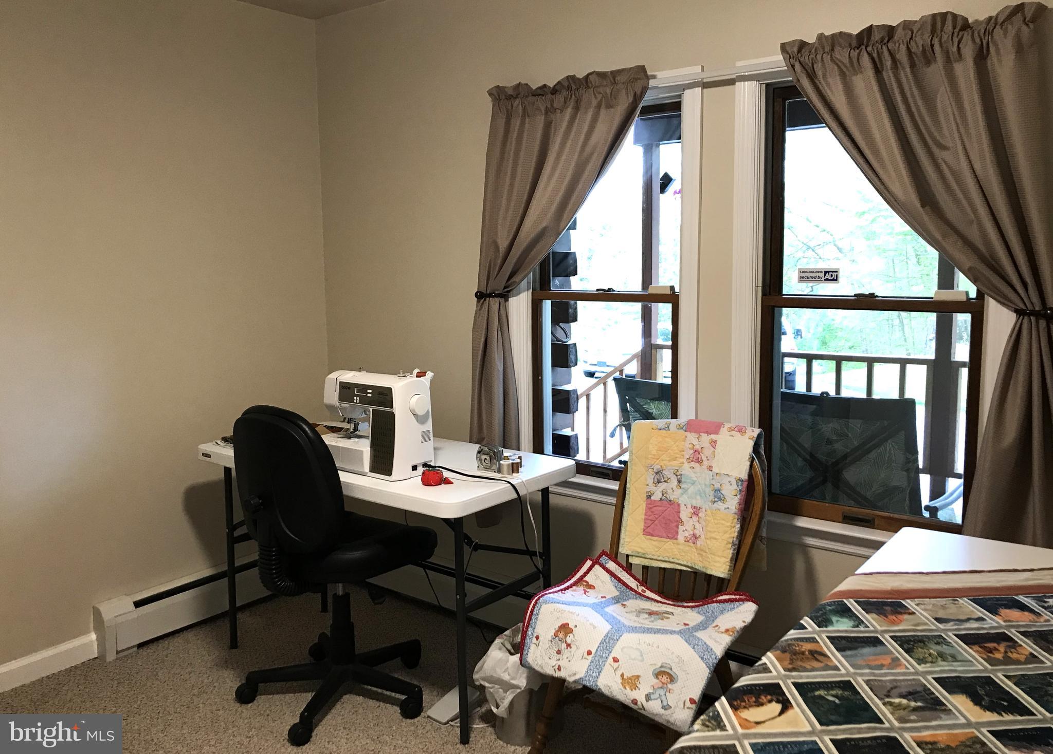 204 Wheatfield Road Reading, PA 19608 - Photo 35 of 50 a workspace with furniture and a window