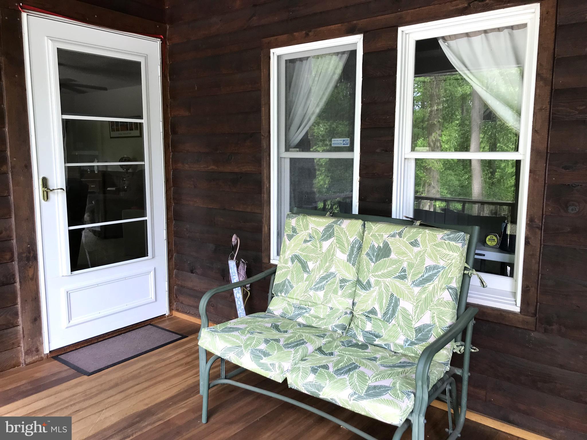 204 Wheatfield Road Reading, PA 19608 - Photo 9 of 50 a view of table and chair in wooden floor