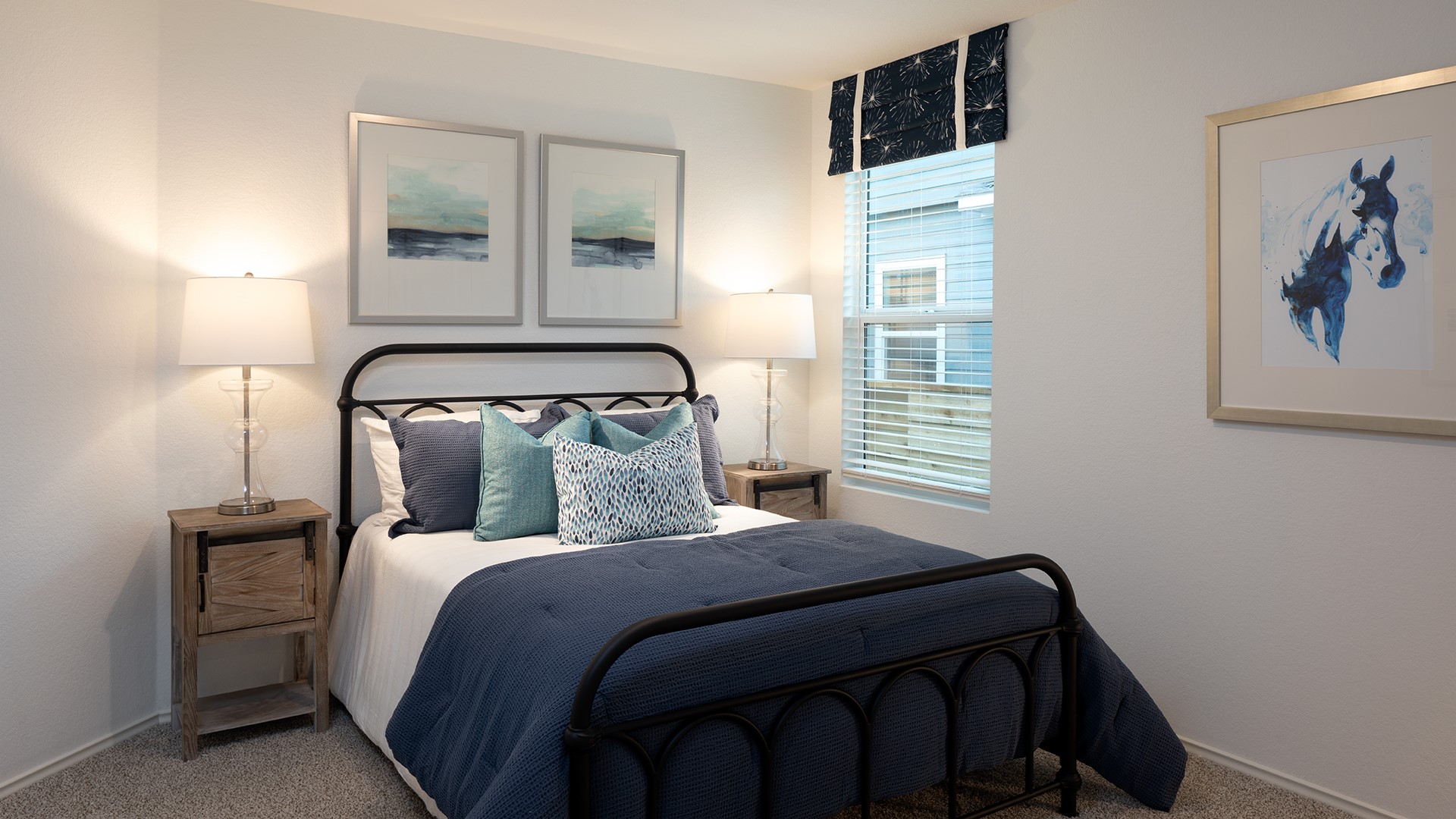 17906 Nashville Warbler Road Pflugerville, TX 78660 - Photo 5 of 14 a bedroom with a bed and painting on the wall