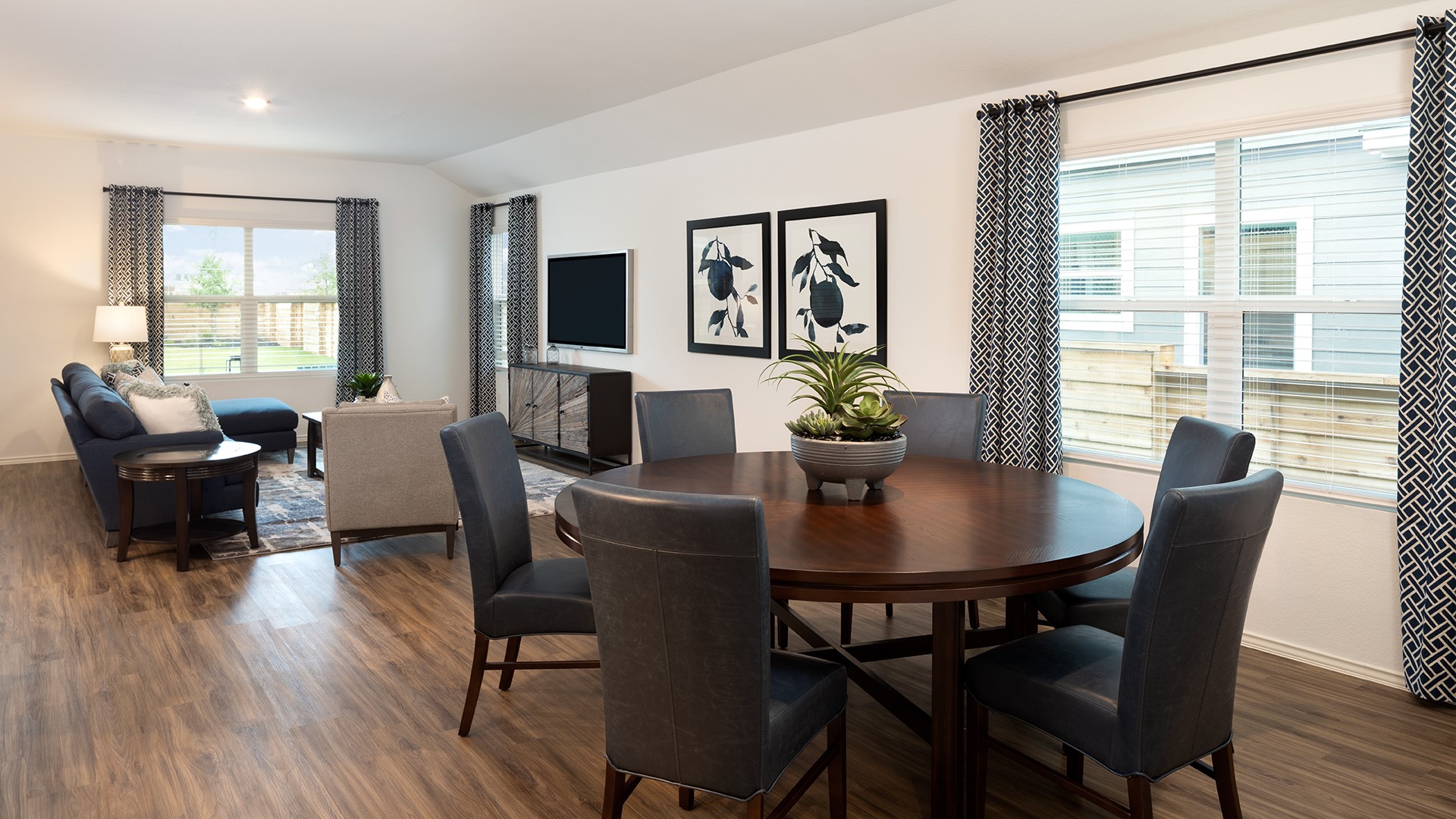 17906 Nashville Warbler Road Pflugerville, TX 78660 - Photo 7 of 14 a view of a dining room with furniture window and wooden floor