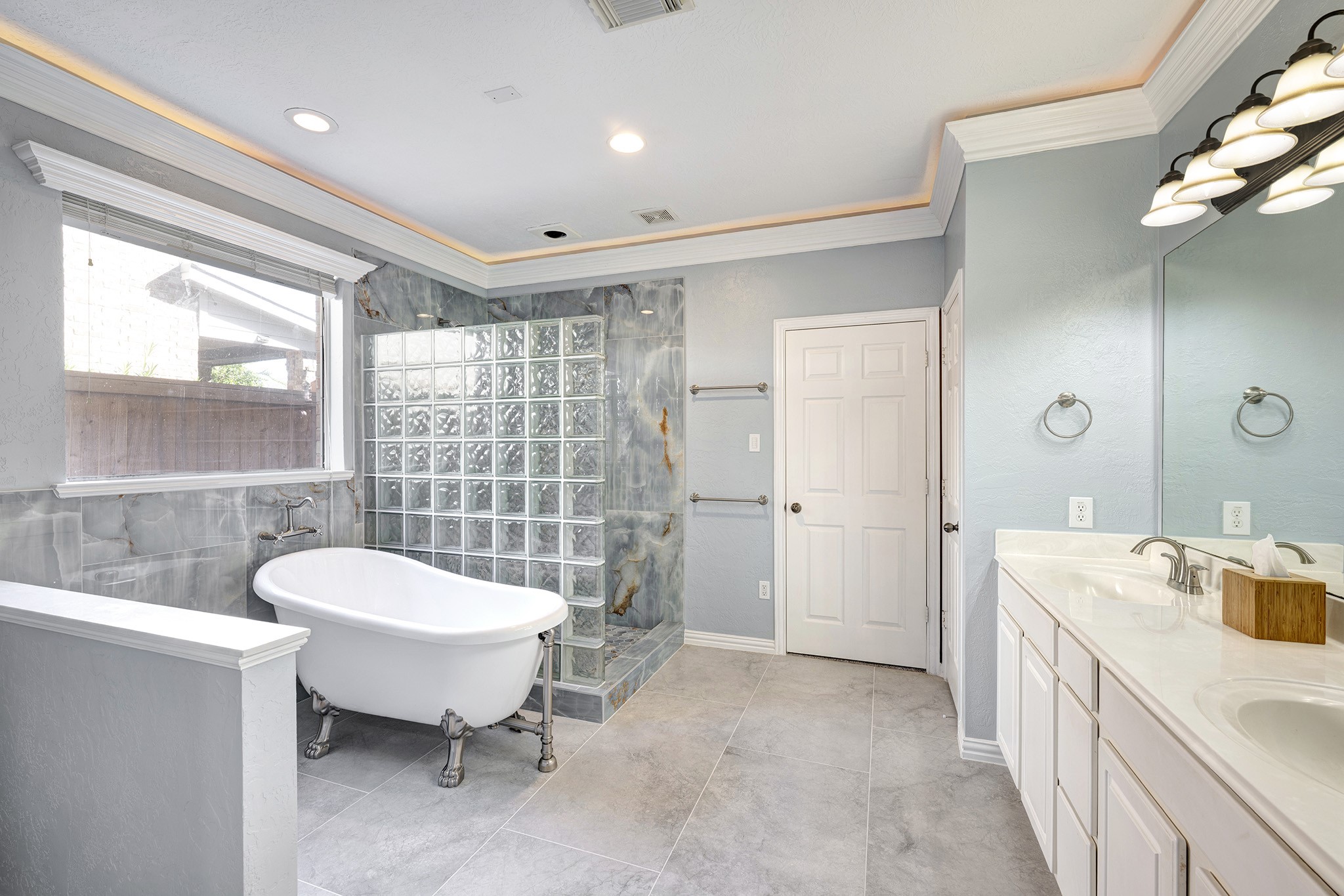 2511 Bridgestone Park Lane Spring, TX 77386 - Photo 13 of 25 The primary bath was recently updated with a new claw foot tub, expanded shower, flooring, and more! Walk-in closet and linen storage are through the doors shown.