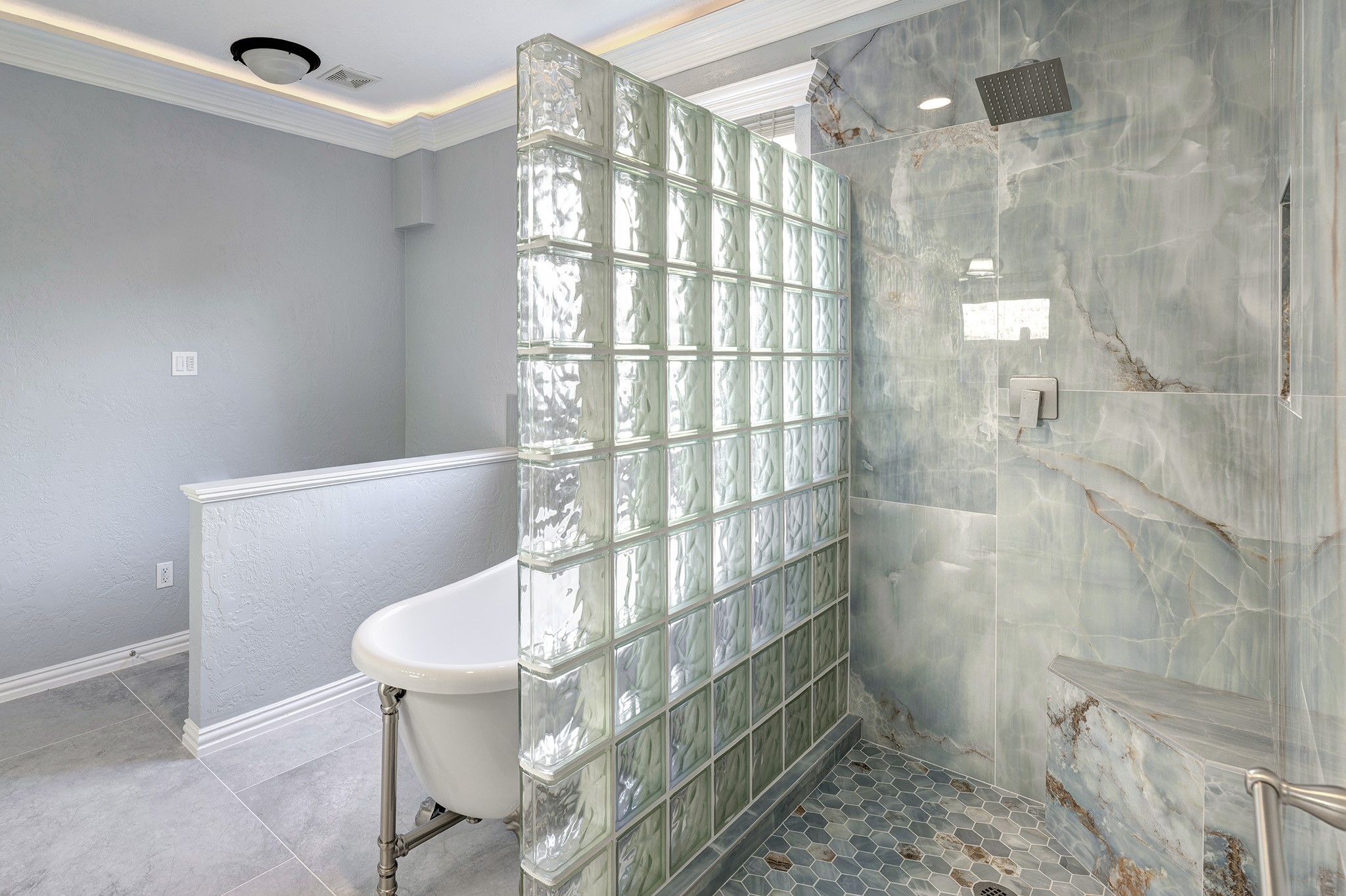 2511 Bridgestone Park Lane Spring, TX 77386 - Photo 14 of 25 The stunning shower has a bench, product niche, and rain shower head.