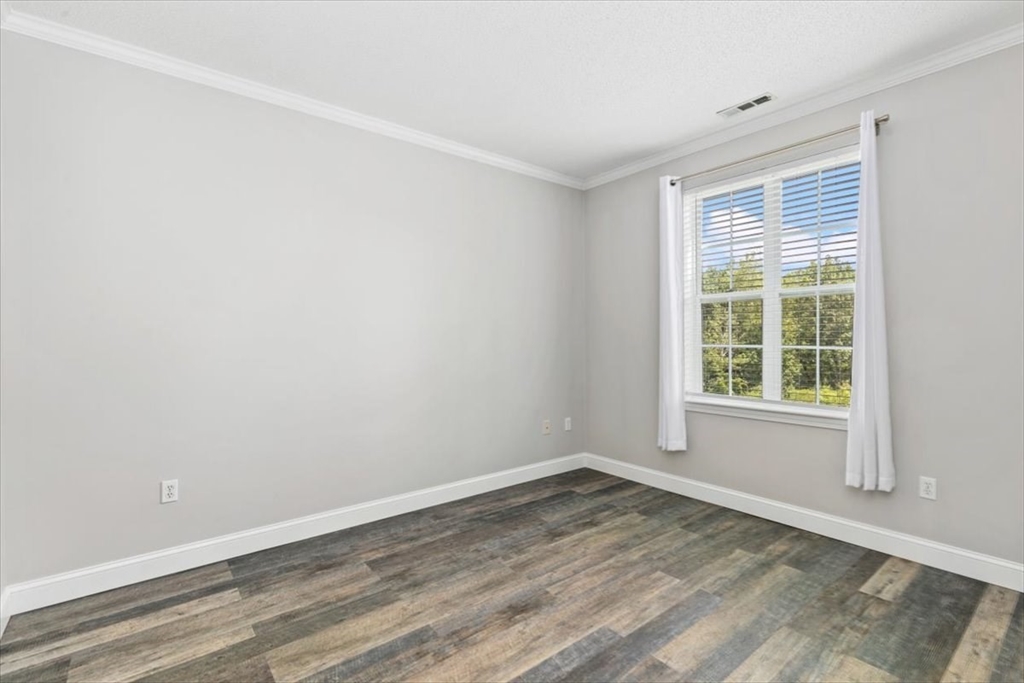 21 Hampshire Road, Unit 313 Methuen, MA 01844 - Photo 16 of 35 a view of empty room with wooden floor