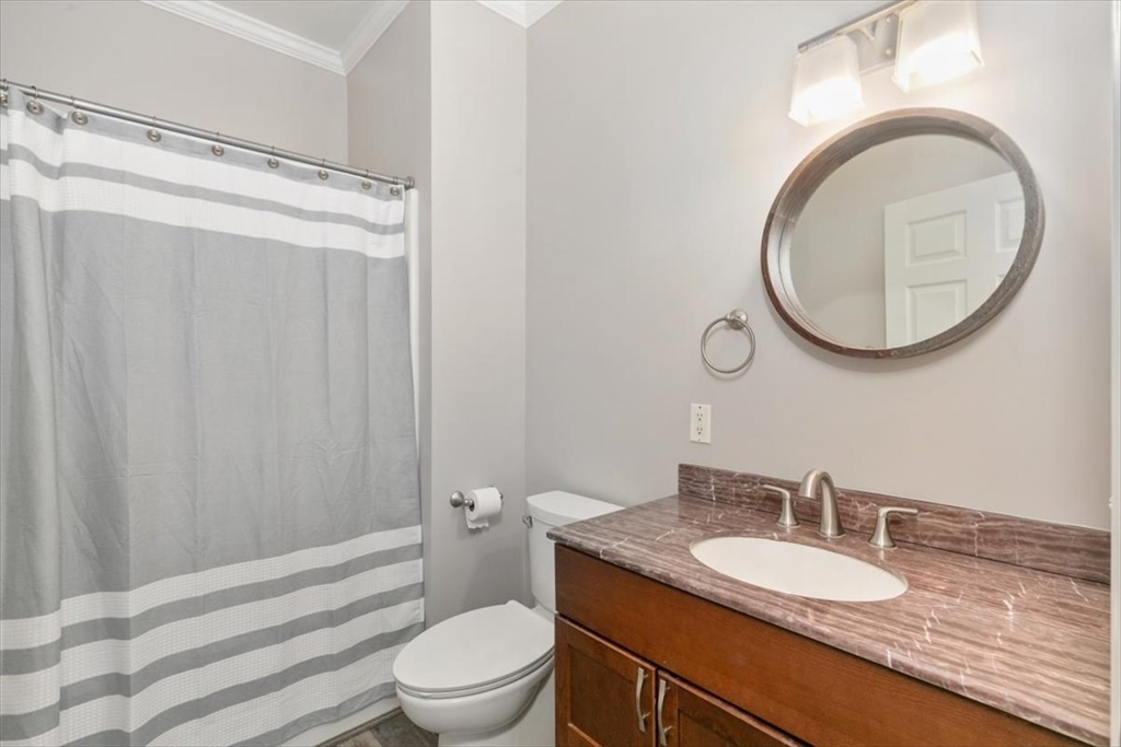 21 Hampshire Road, Unit 313 Methuen, MA 01844 - Photo 18 of 35 a bathroom with a granite countertop sink toilet mirror vanity and shower