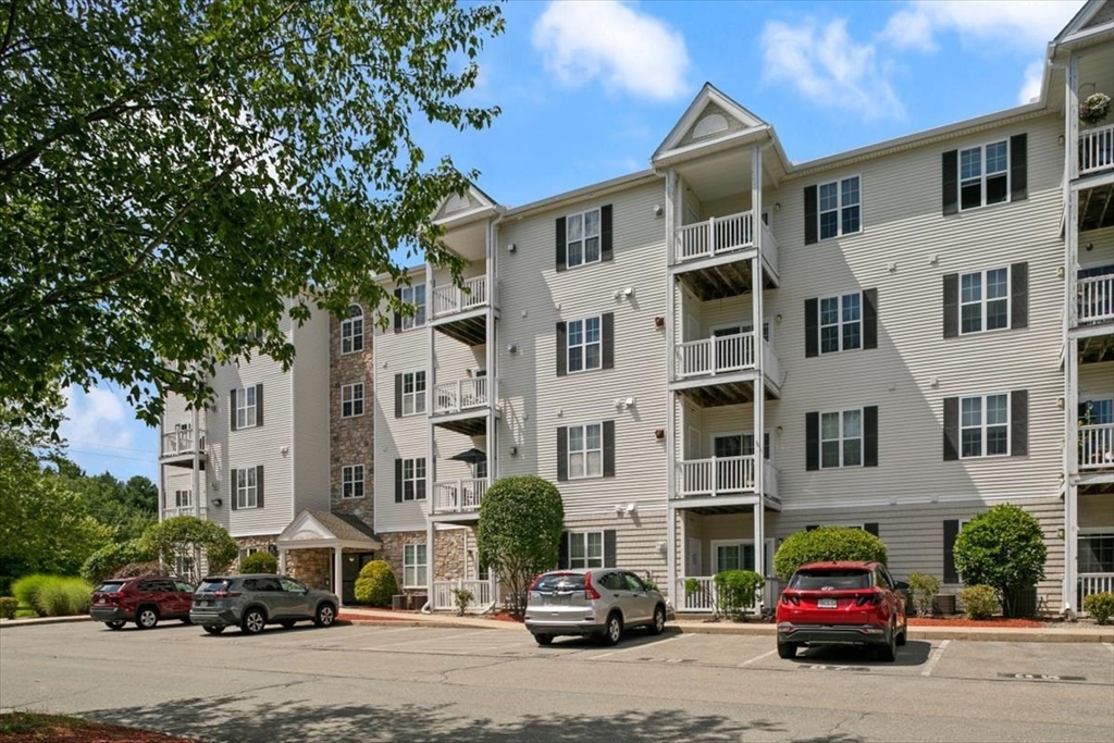 21 Hampshire Road, Unit 313 Methuen, MA 01844 - Photo 21 of 35 a car parked in front of a building